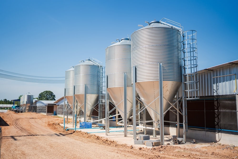 Feed silos at commercial chicken unit